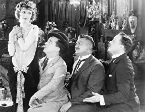 Longing: Three men looking longingly at a woman