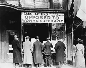 Posted: Men looking at material posted in the window of