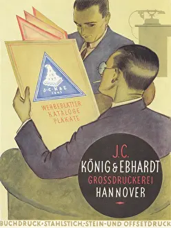 Konig: Men looking at printed artwork