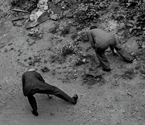 Shrapnel: Men looking for shrapnel, 1940