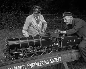 Enthusiasts: Men with model working steam engine