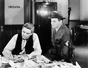 Employ: Two men at an office