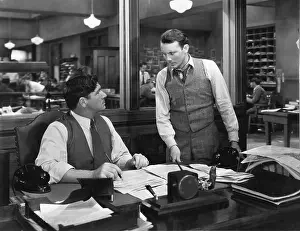 Employ: Two men at an office