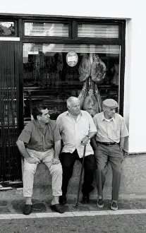 The Japics Historic Image Collection: Three men outside shop, Spain
