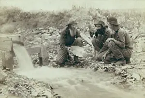 Lcgr1711: Three men panning for gold in a stream in the Black