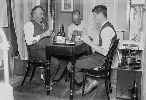 Lcgr1803: Two men playing cards in a home in Broad Channel