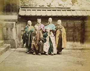 Shaved: Six men, possibly monks, posed for group portrait, four stan