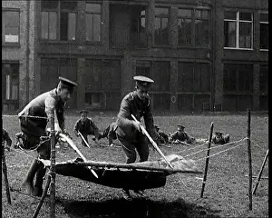 Practising: Men Practising Crossing Barbed Wire. They Are