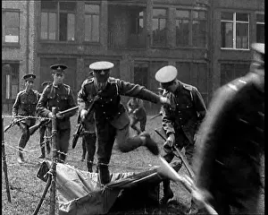 Practising: Men Practising Crossing Barbed Wire. They Are