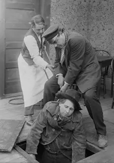 Trapdoor: Two Men Pulling Cowboy Up Form