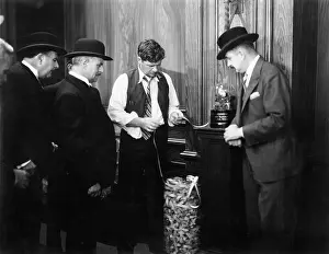 Bureaus: Men reading the ticker machine