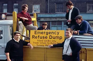 Hollington: Men with refuse lorry on a London street