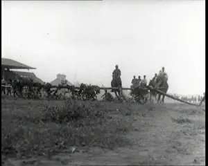Jumps: Men Riding Cavalry Horses in a Simple Race