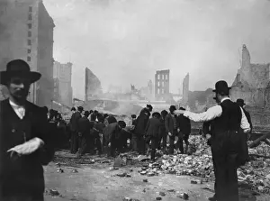Smoldering: Men search the rubble of a store, after the April