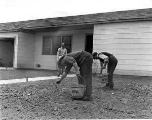 Lawns: Men Seeding a Lawn
