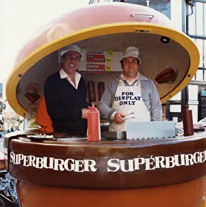 Dispensers: Two men serving superburgers