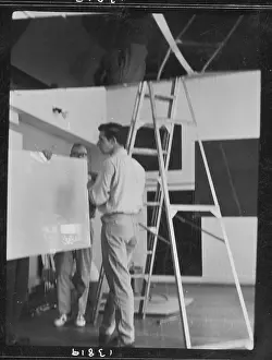 Stepladder: Men setting up an exhibition, ICA, London