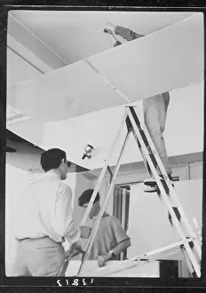 Stepladder: Men setting up an exhibition, ICA, London