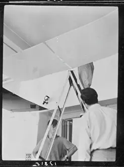 Stepladder: Men setting up an exhibition, ICA, London