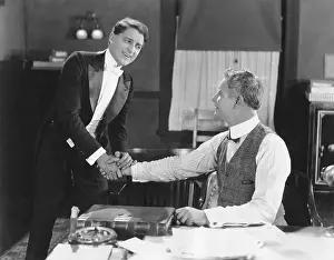 Cheerfulness: Two men shaking hands