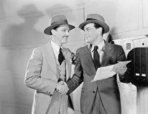 Letterbox: Two men shaking hands