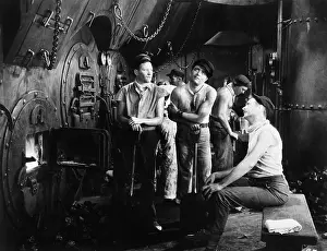 Macho: Men together in a ship's boiler room