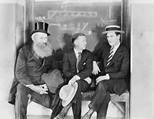 Friendliness: Three men sitting on a bench
