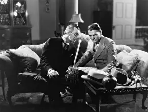 Fedora: Two men sitting on a couch