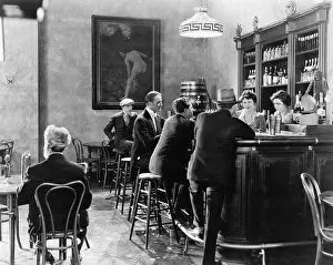 Everett Collection (old Visuals): Men sitting around a counter in a bar