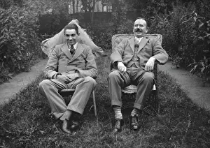 Flowerbed: Two men sitting in a garden