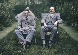 Flowerbed: Two men sitting in a garden