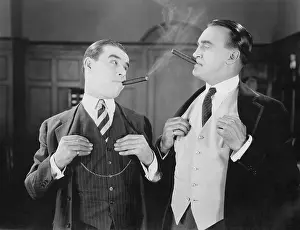 Imitating: Two men smoking cigars