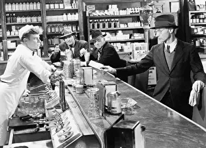Drugstore: Four men at a soda fountain