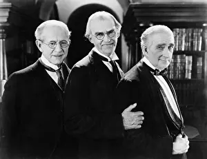50 60: Three men standing together