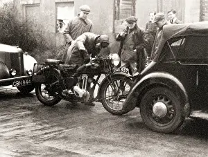 Michael Cole: Men standing around an Ariel motorcycle
