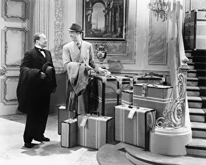 Corridors: Two men standing in the hallway with many suitcases