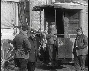 Unloads: Men Standing In Front of a Railway Carriage