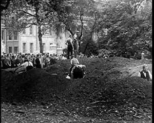 Heaps: Men Standing Behind Spoil Heaps In and By a