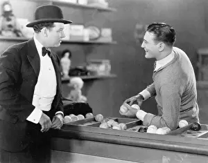 Baseballs: Two men standing together talking