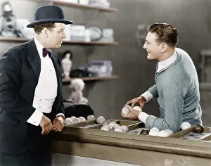 Baseballs: Two men standing together talking