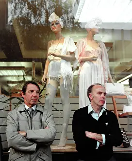 Mannequin: Two men standing in front of window display