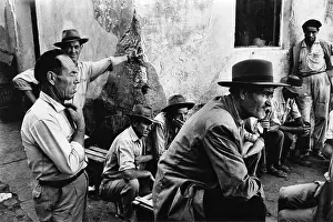 Berets: Men in the street at Almunecar, Spain