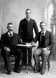 Eggers: Three Men at Table - Studio Portrait