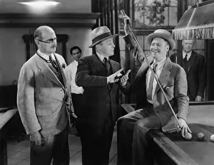 Mustaches: Two men talking to each other and a man standing