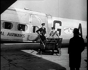 Tending: Three Men Tending to a Plane on the Ground