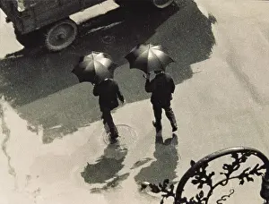 Thirties Style: Two men with umbrellas