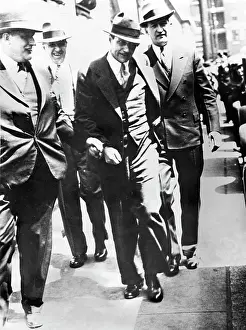 Trilby: Men walking along a street
