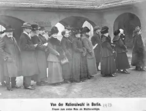 Allowed: Men and women are standing in line in front