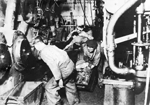 Stokers: Men at work in engine room of a ship, WW1