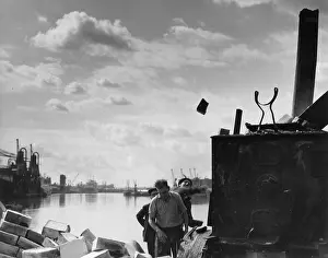 Silhouetted: Men at work in Manchester Docks